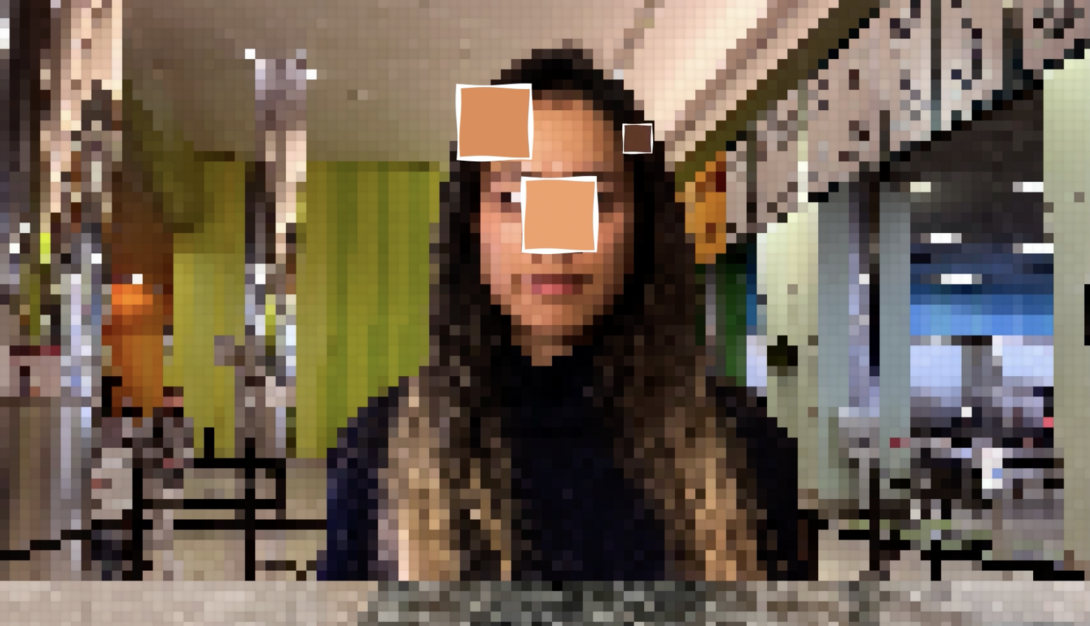 A pixelated facial recognition screen