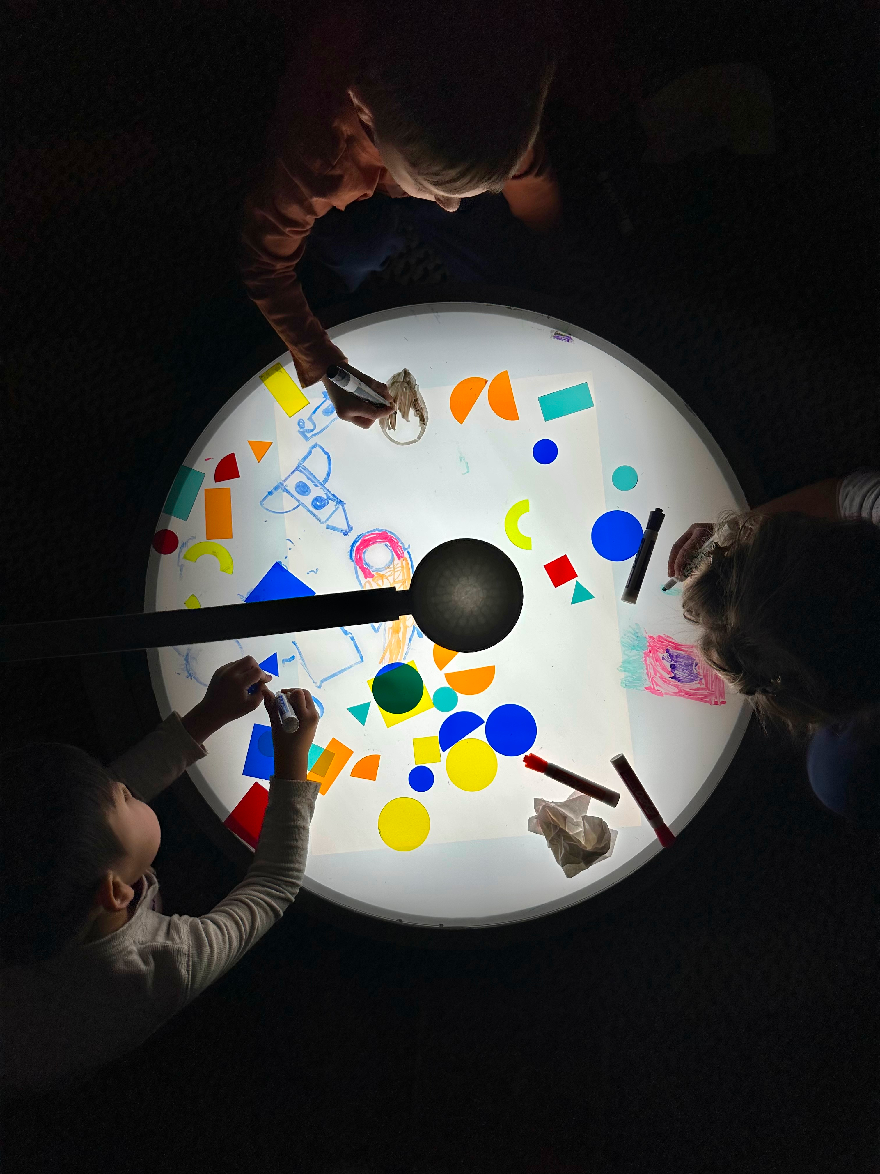 An overhead view of kids using the Arc Projector