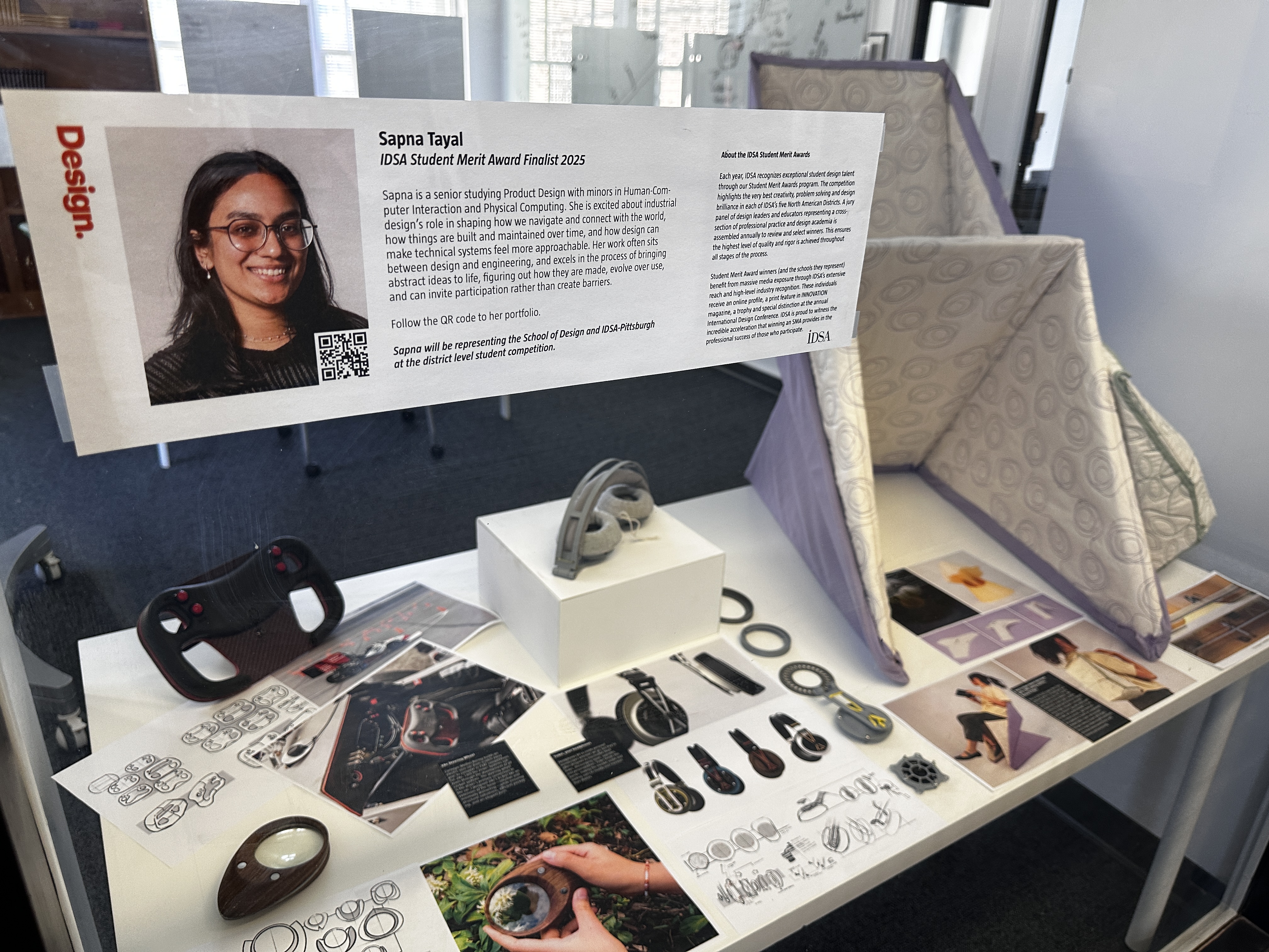 view of Ballay Center display window featuring student work