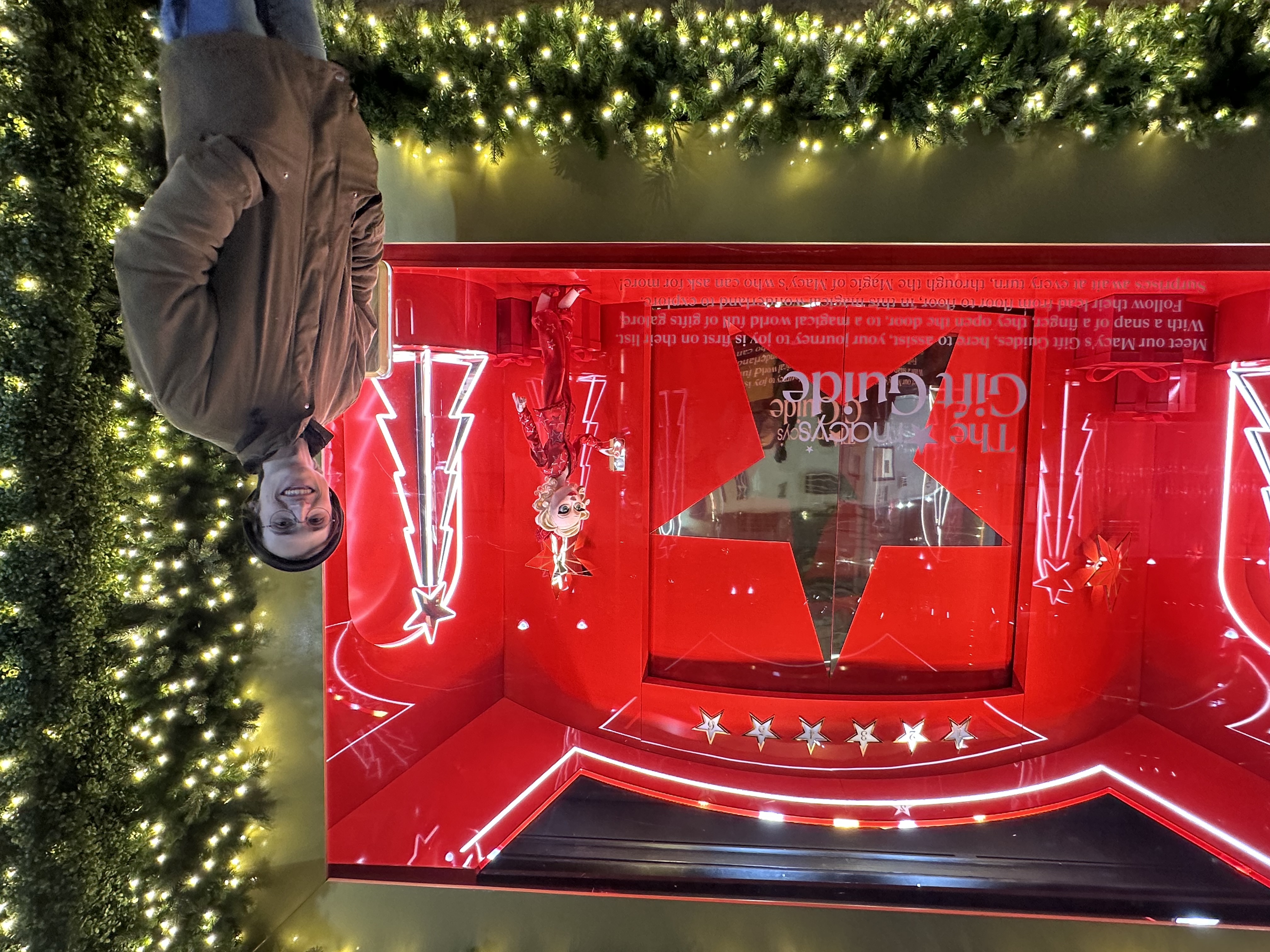 Joe Neely in front of a Macy's Window