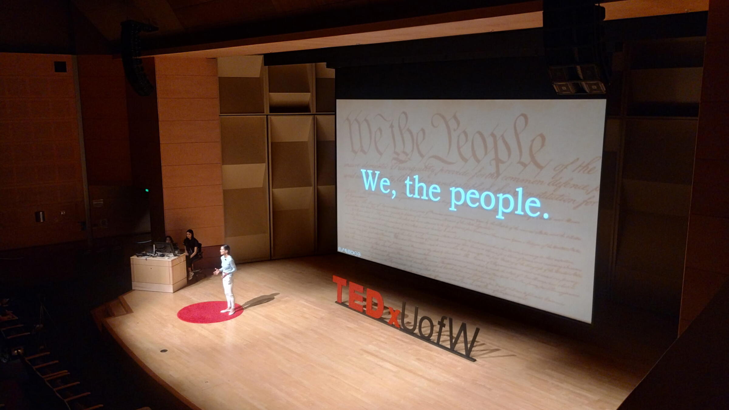 Ana Maria Pinto da Silva on stage giving a TED Talk