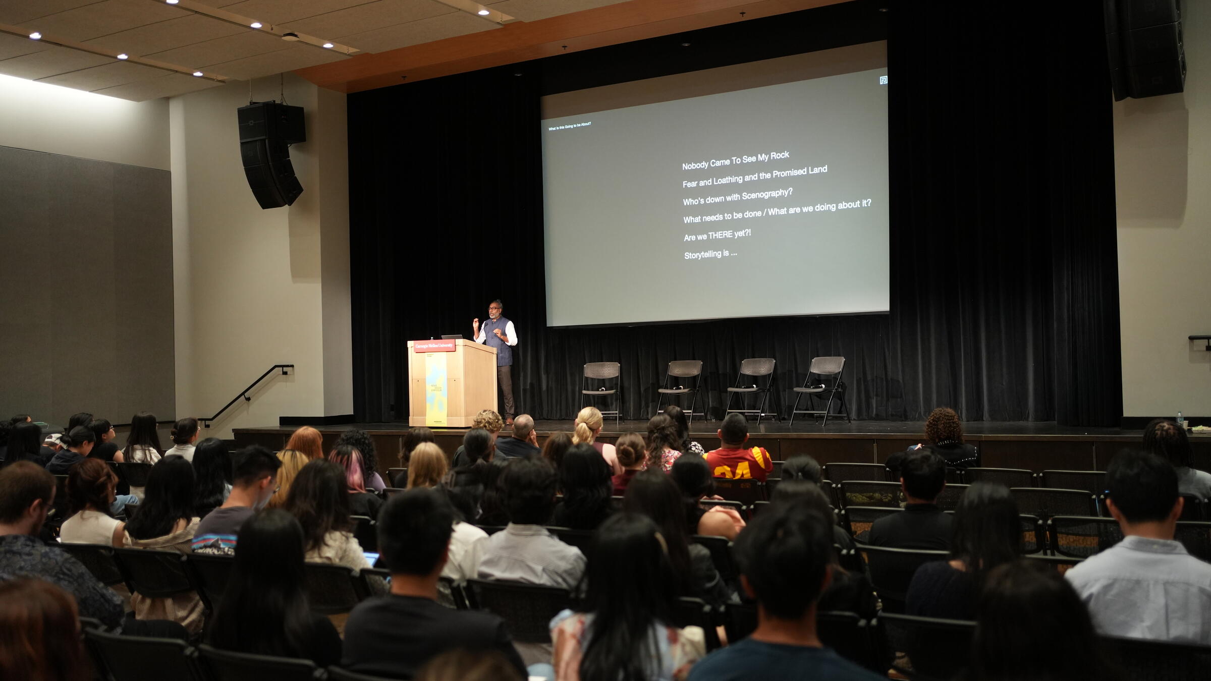 A speaker at the Nexus Design Symposium