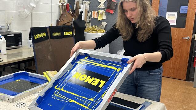 A senior printing a student run magazine.