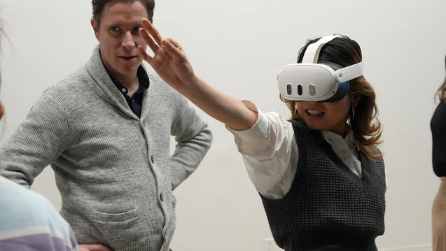 A Master's student demonstrating a prototype in an AR headset.