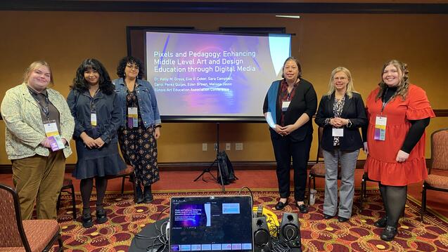 Kelly Gross and her colleagues at a presentation