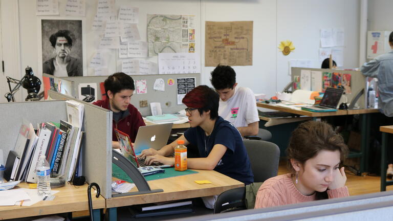Students working at their desks in their studio