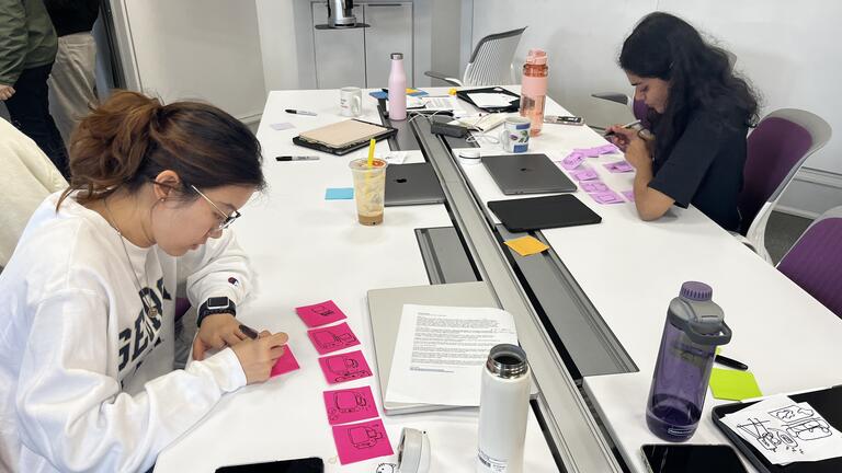 Grad students working in their studio