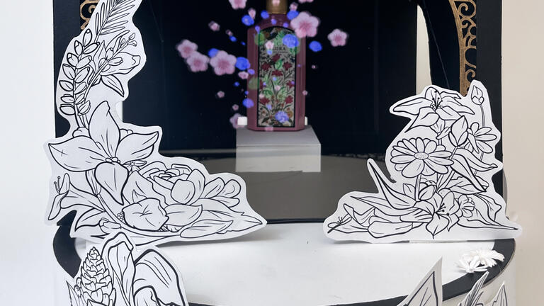 A bottle of perfume with a holographic effect around it