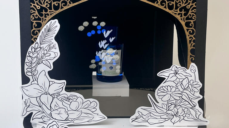 A bottle of perfume with a holographic effect