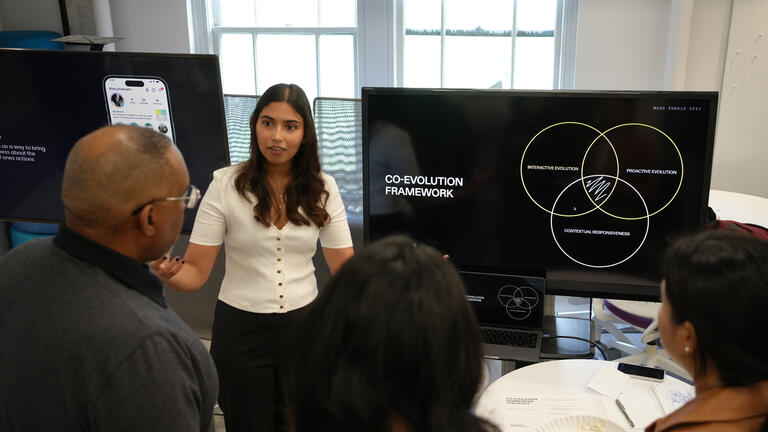 An MDes student presenting her thesis
