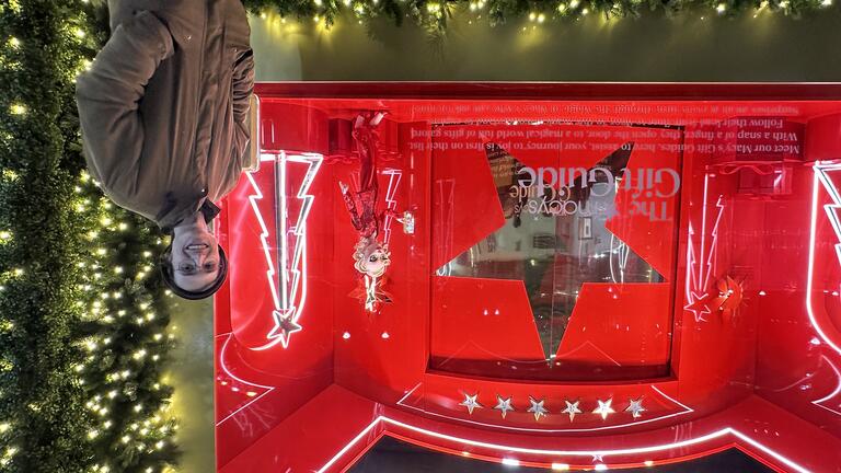 Joe Neely in front of a Macy's Window