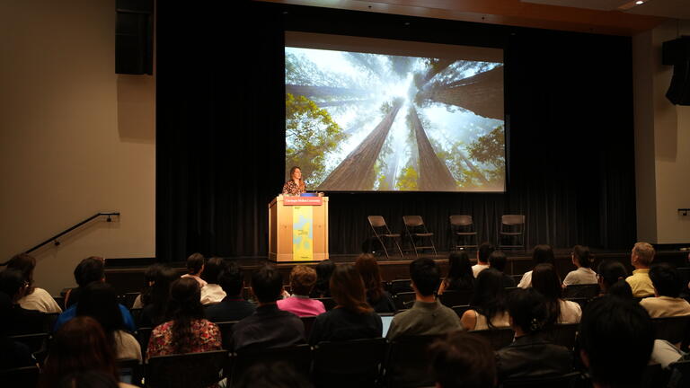 Megan Neese speaking at the Nexus Design Symposium