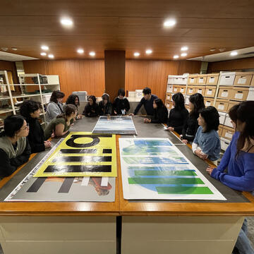 Communications students looking at work in the Hunt Library