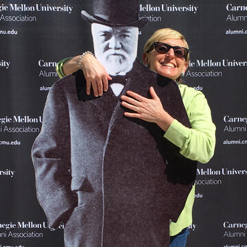 Karen McCurdy and a cutout of Andrew Carnegie