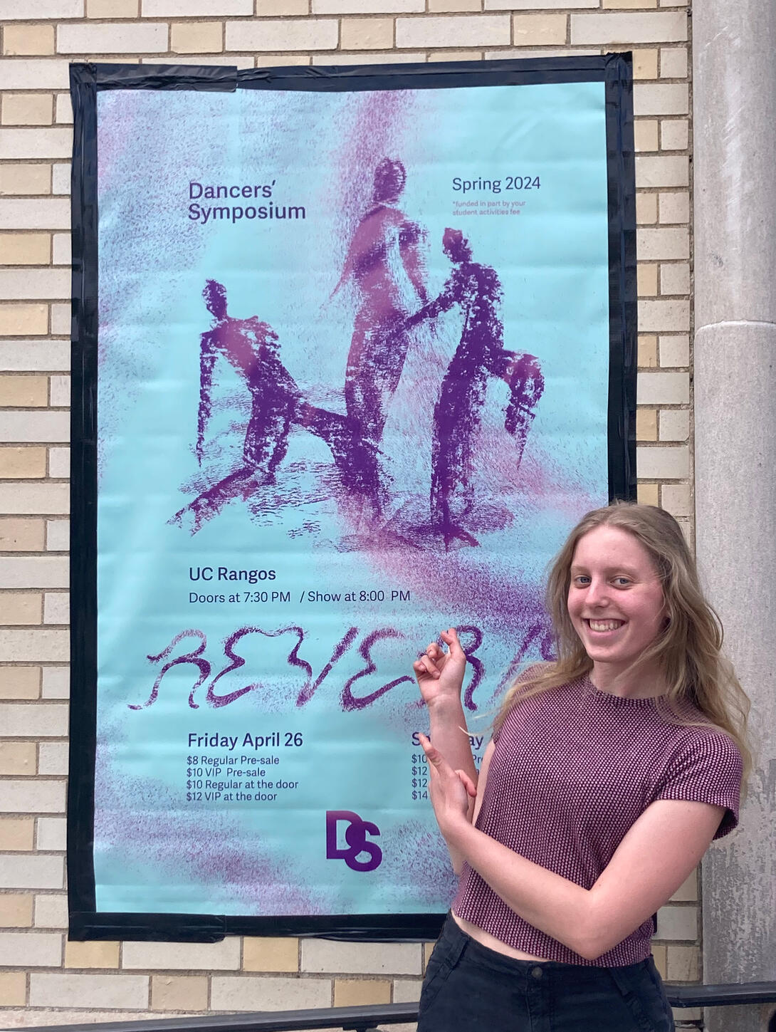 Michele Hratko in front of her poster for Reverie
