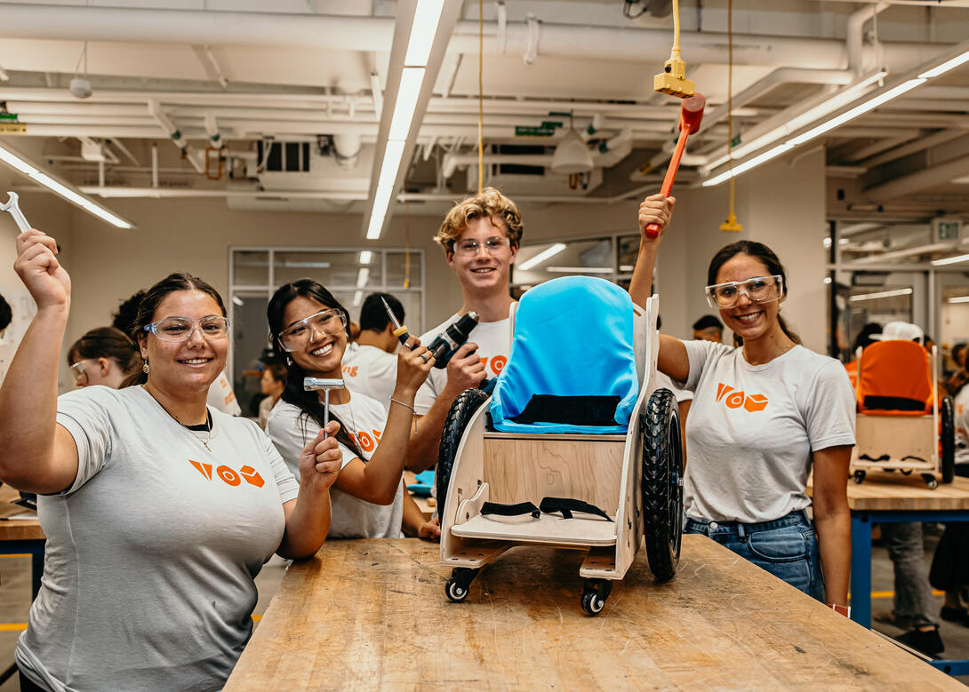 A team of TOM Fellowship students building a mobility scooter