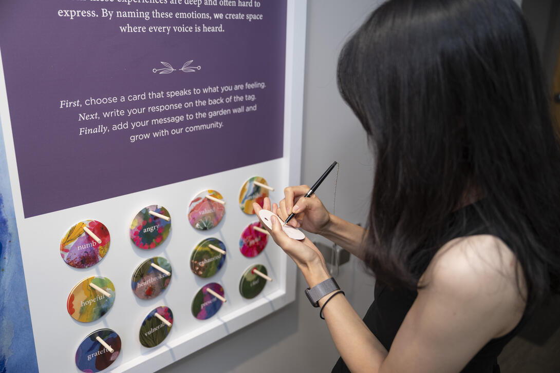 A person contributing to the Groundswell art wall