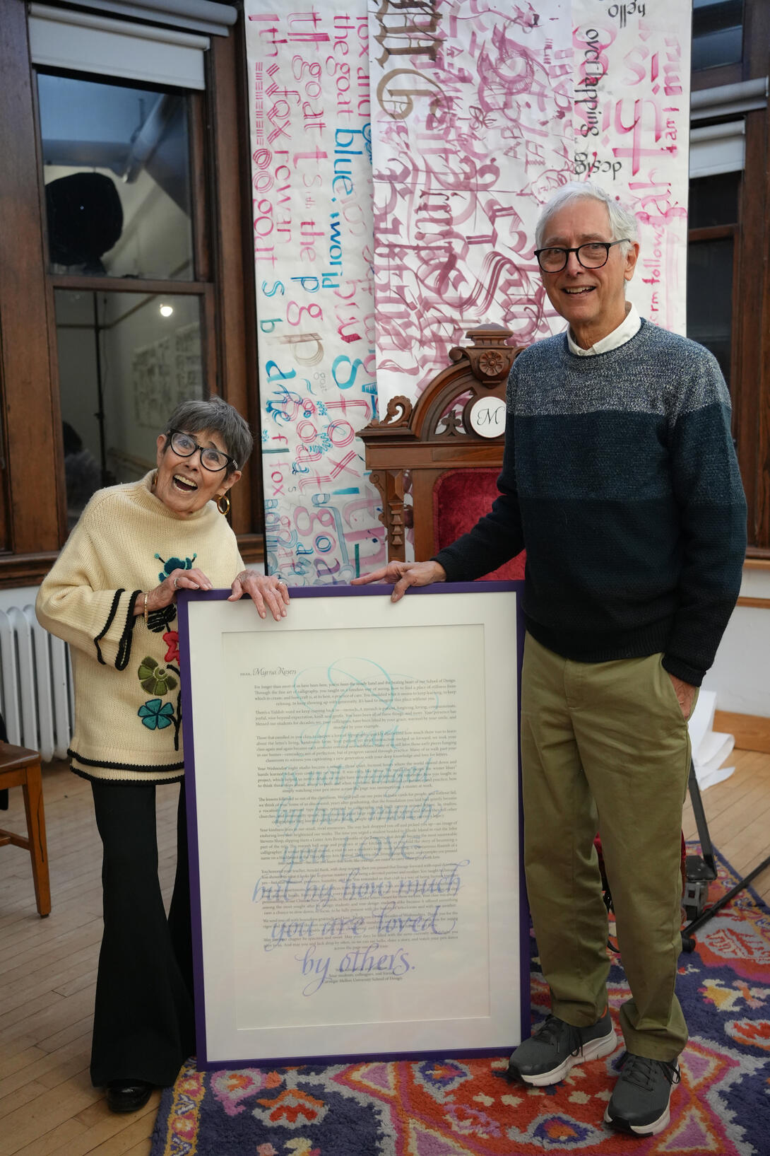 Myrna next to a gift