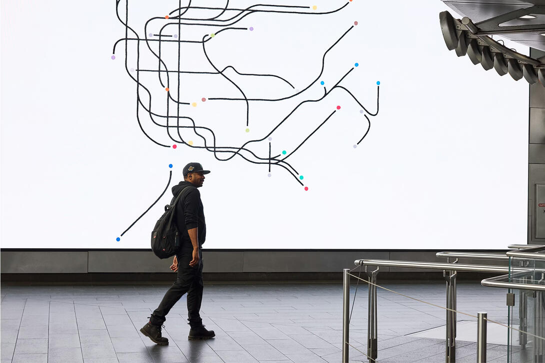 A mane walking through the Fulton Center