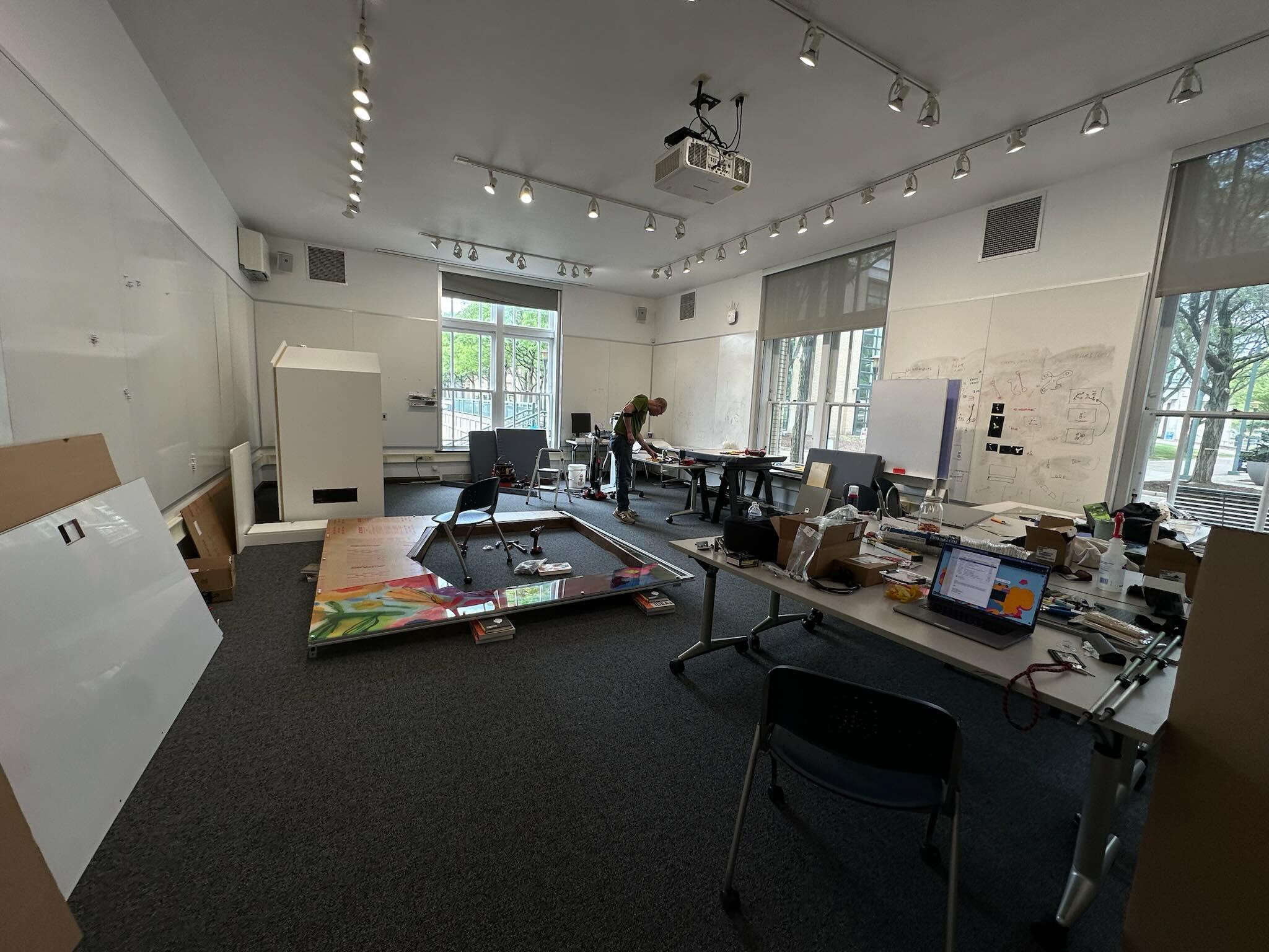 A man working on constructing a meditation pod