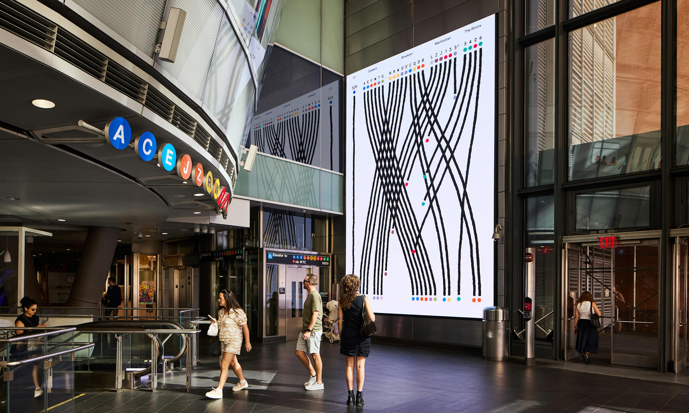 People walking through the Fulton Center